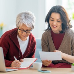 CF Probate Image | image of an elderly lady and a younger person completing paper work