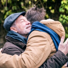 CF Will Protecting Image | image of an elderly gentleman embracing a younger person